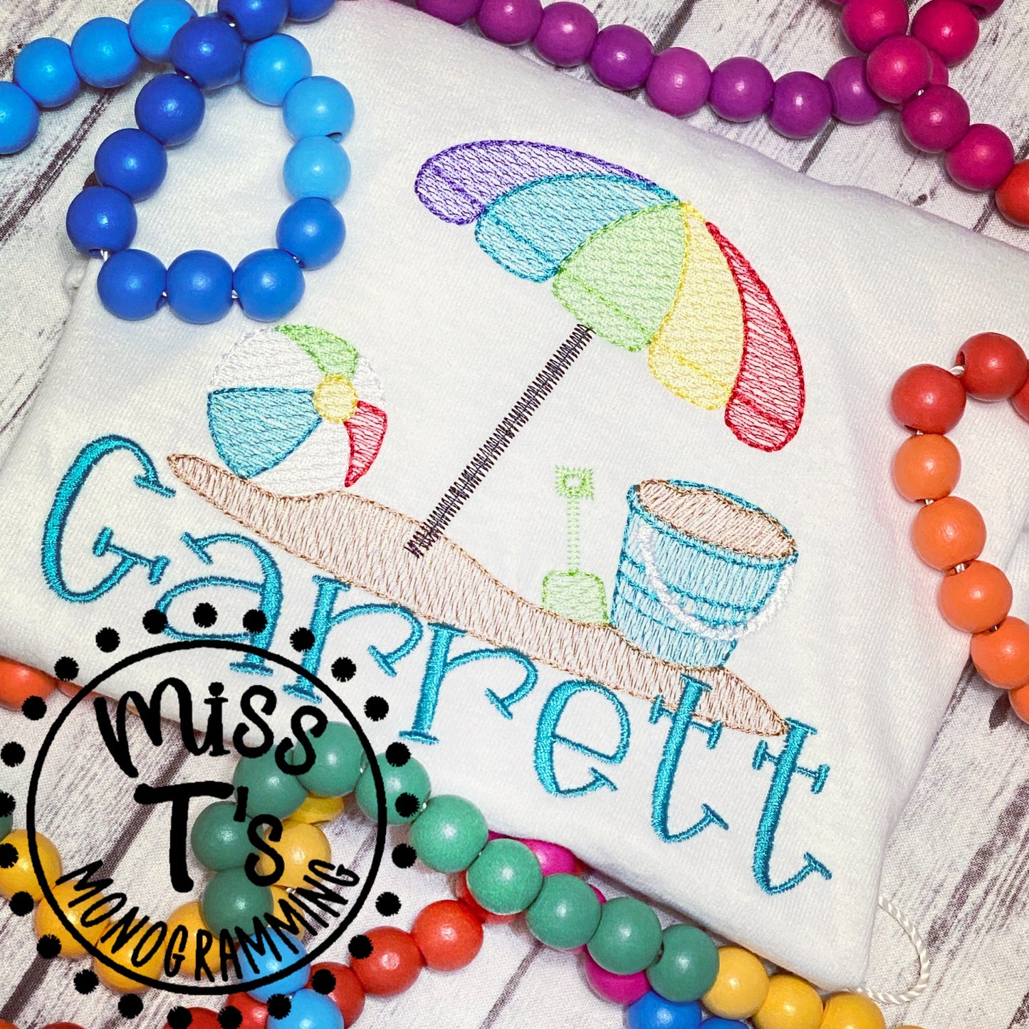 UMBRELLA, BEACH BALL & PAIL SKETCH EMBROIDERY KIDS TEE