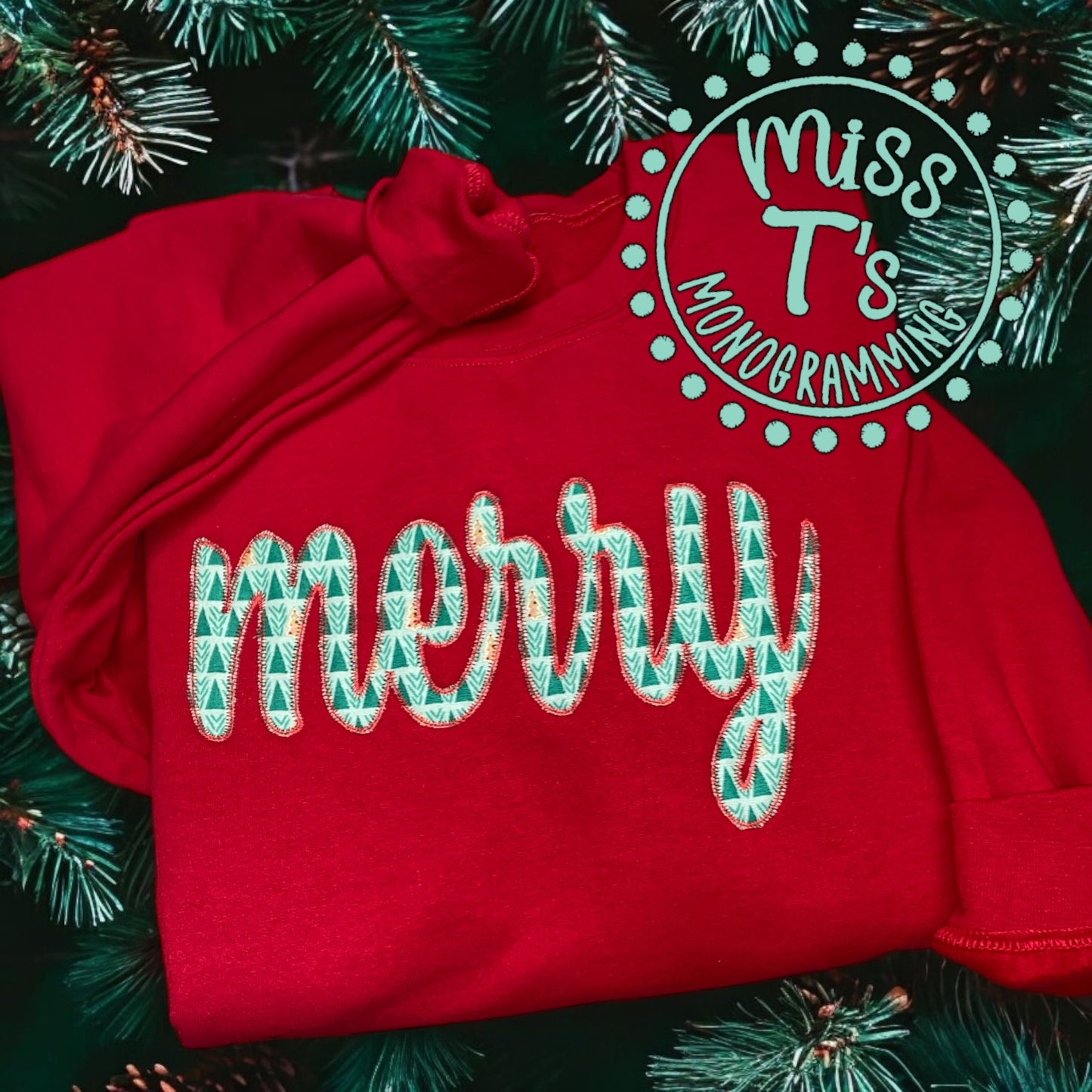 CURSIVE MERRY APPLIQUE ON RED SWEATSHIRT -SIDE BOWS