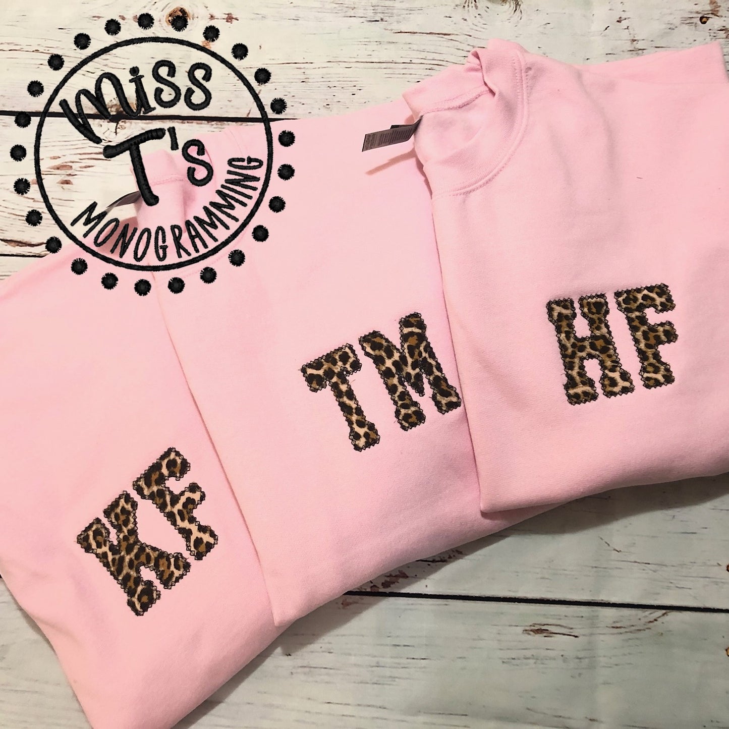 TWO INITIAL LEOPARD APPLIQUE SWEATSHIRTS
