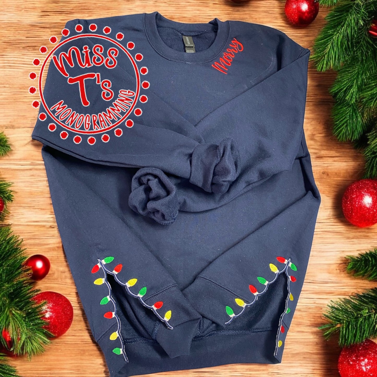 CHRISTMAS LIGHTS SPLIT DESIGN WITH MERRY AT NECKLINE EMBROIDERED SWEATSHIRT