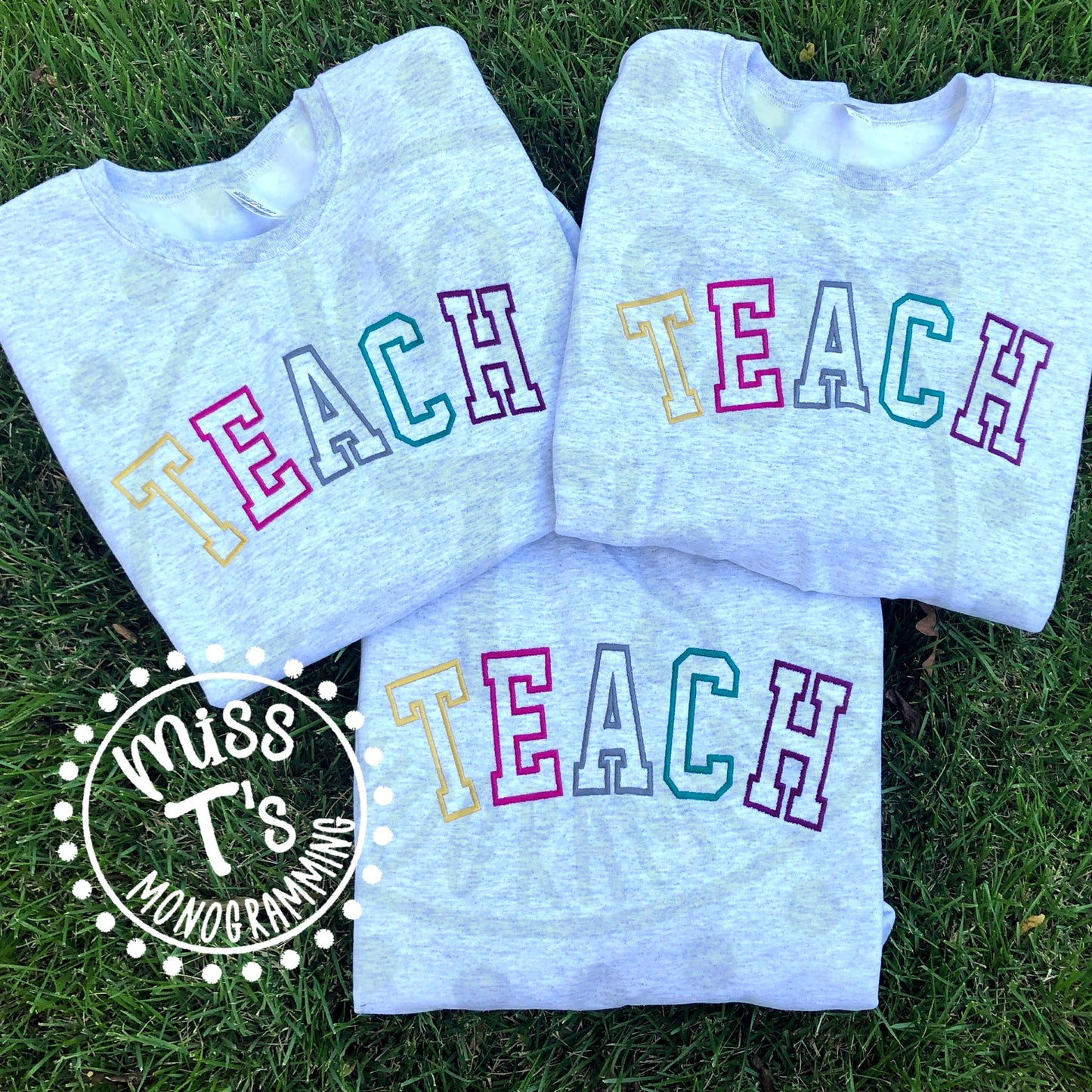 "TEACH"  MULTI COLOR VARSITY OUTLINE SWEATSHIRT